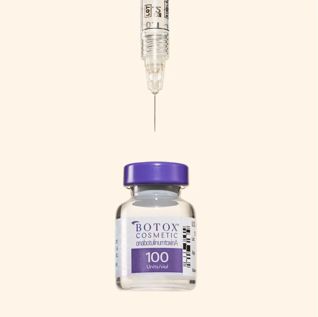 A vial of Botox Cosmetic with a syringe above it
