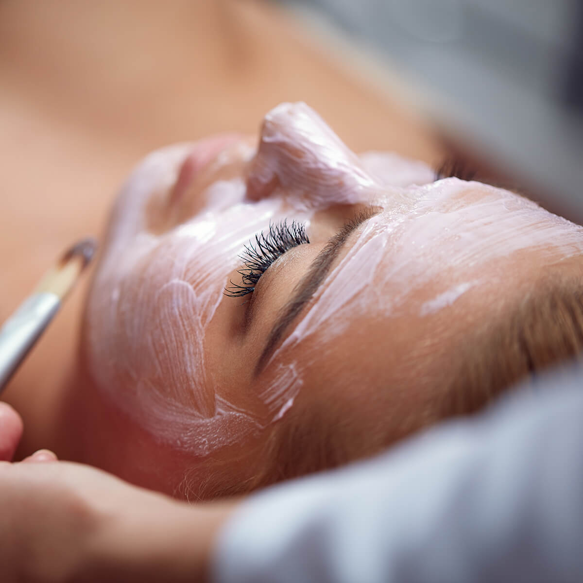 Woman receiving a professional facial treatment